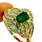 14Kt LADIES EMERALD SOLITAIRE AND DIAMOND ENCRUSTED RING. 1CTW EMERALD | .80CTW DIAMOND